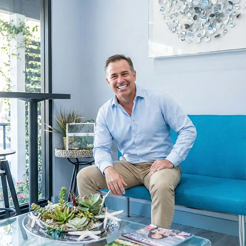 Patient smiling confidently with dental implants